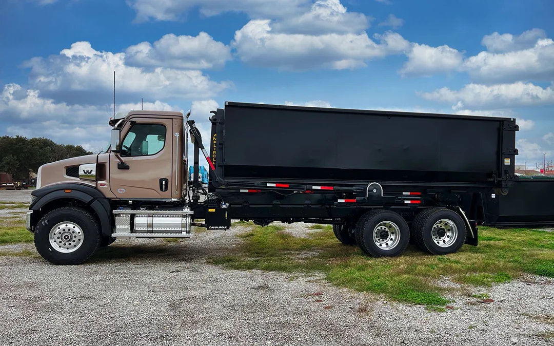 Alamo Disposal tan Western Star roll-off truck